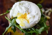 Cheesy Black Bean Stuffed Sweet Potatoes with Arugula & Poached Eggs