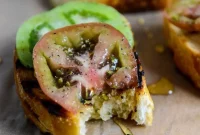Grilled Sourdough with Herbed Butter, Heirloom Tomatoes & Honey Drizzle
