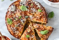 Cheesy Bucatini Pie with Mini Meatballs Recipe