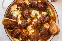 Baked Pesto Meatballs with Burrata and Melted Cheese