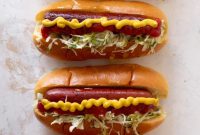 Grilled Hot Dogs Topped with Tangy Pickle Slaw for Your BBQ