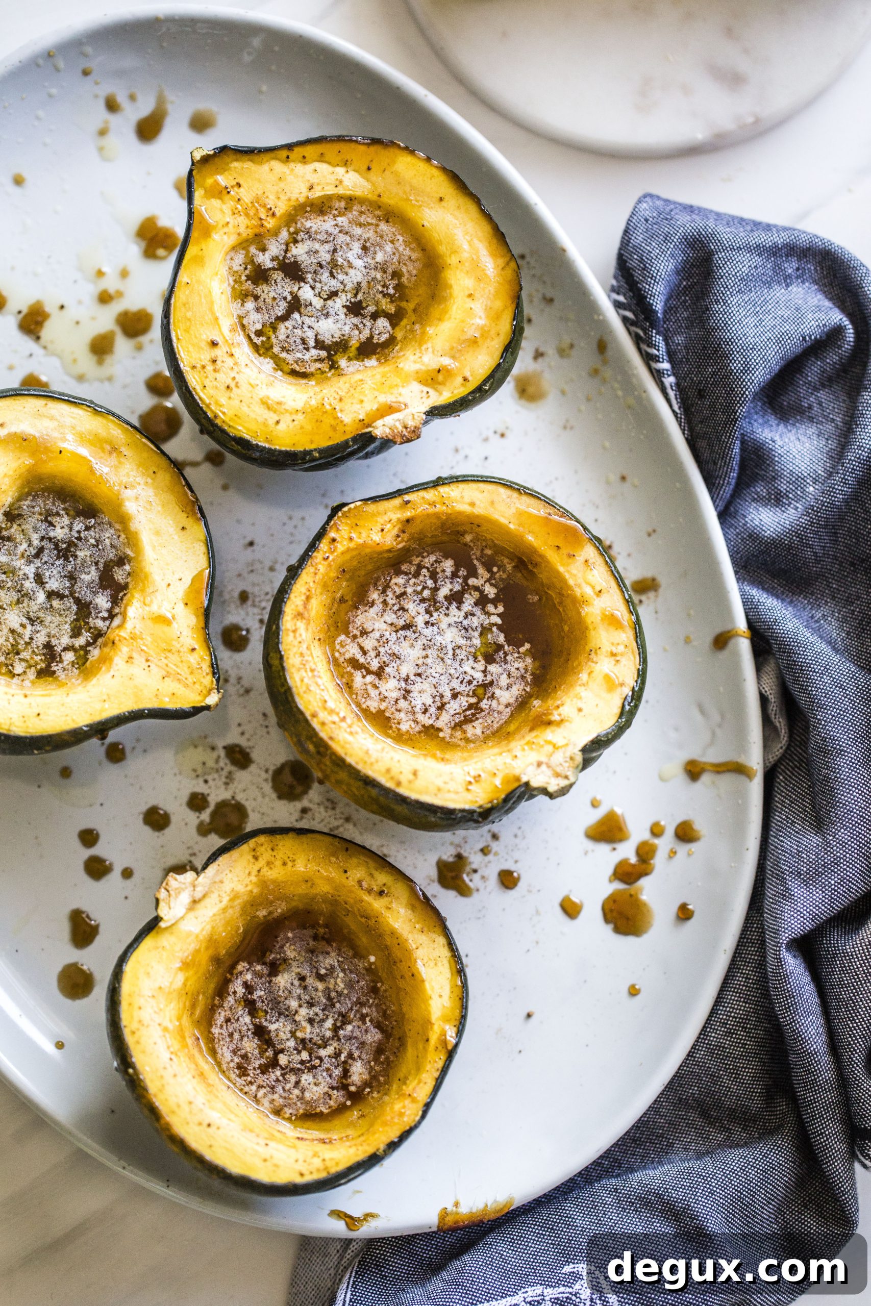 Baked Acorn Squash with Vanilla Bourbon and Balsamic Glaze 2 This baked acorn squash recipe is so delicious for the fall! It's made with vanilla and bourbon, finished with balsamic, is super easy, a bit indulgent and perfect for the season. Makes for a fabulous side dish in autumn or even a dessert! I howsweeteats.com #acorn #squash #baked #vanilla #bourbon
