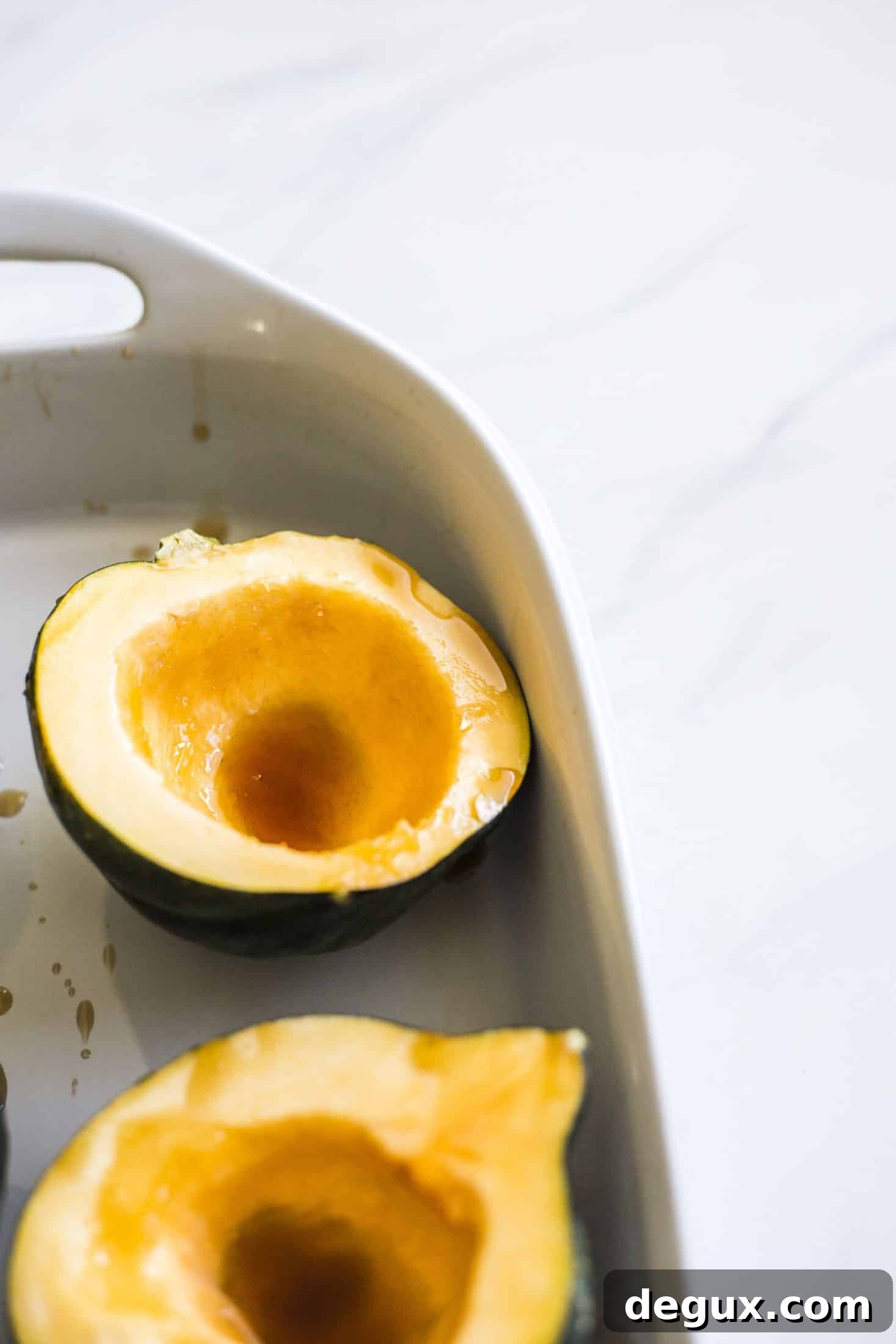 Baked Acorn Squash with Vanilla Bourbon and Balsamic Glaze 3 This baked acorn squash recipe is so delicious for the fall! It's made with vanilla and bourbon, finished with balsamic, is super easy, a bit indulgent and perfect for the season. Makes for a fabulous side dish in autumn or even a dessert! I howsweeteats.com #acorn #squash #baked #vanilla #bourbon
