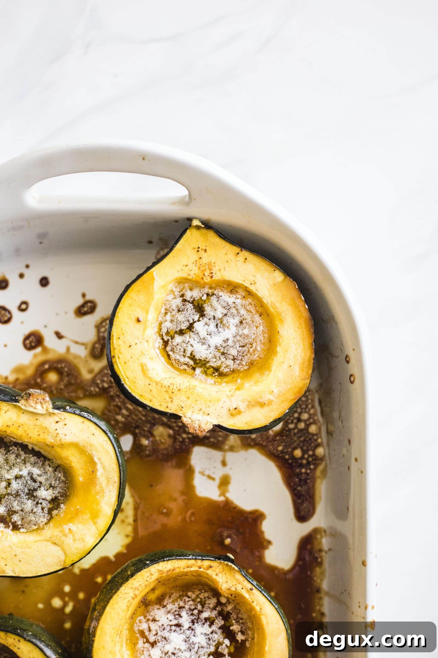 Baked Acorn Squash with Vanilla Bourbon and Balsamic Glaze 4 This baked acorn squash recipe is so delicious for the fall! It's made with vanilla and bourbon, finished with balsamic, is super easy, a bit indulgent and perfect for the season. Makes for a fabulous side dish in autumn or even a dessert! I howsweeteats.com #acorn #squash #baked #vanilla #bourbon