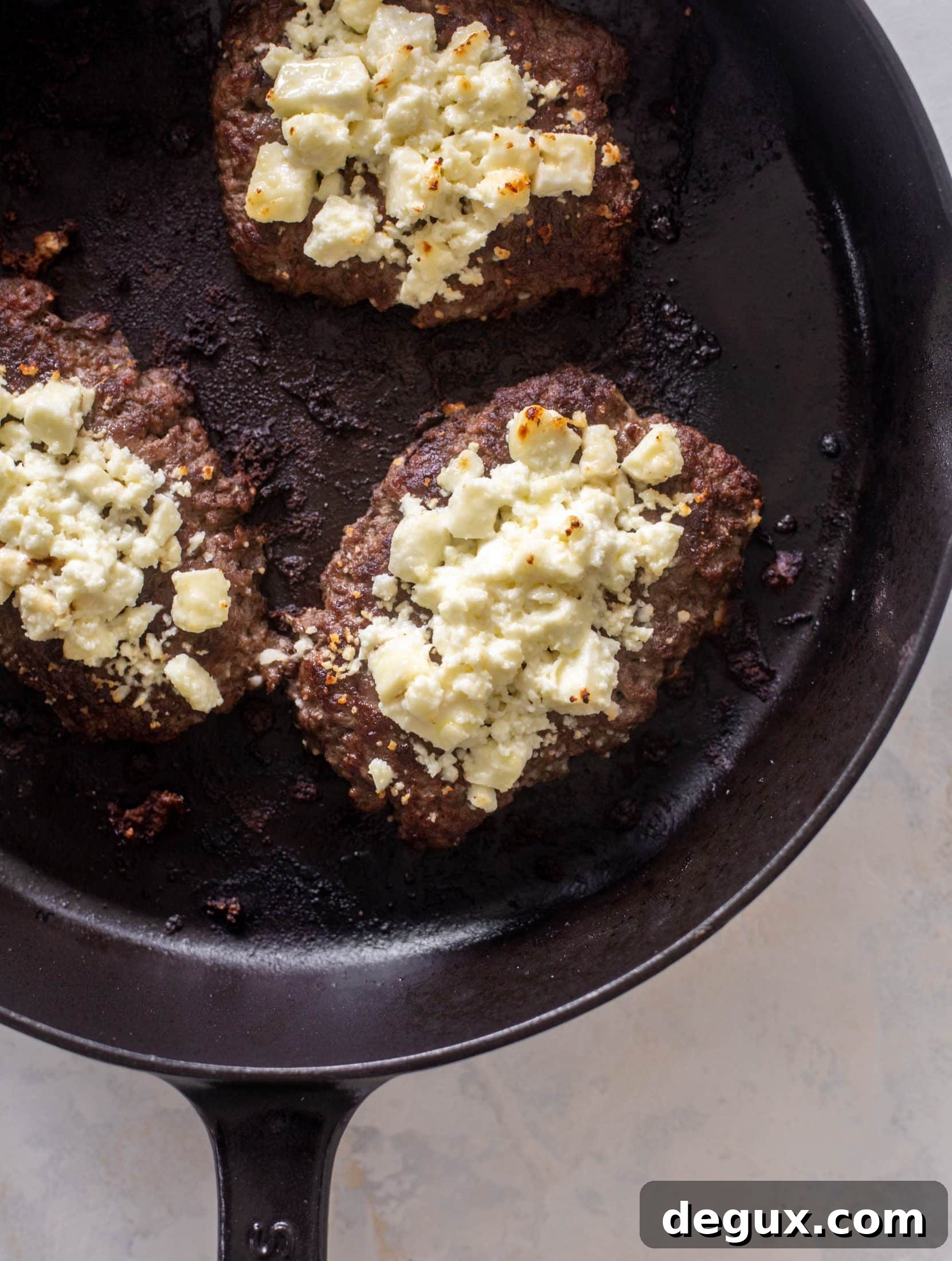 Creamy Feta Burger Pitas with Tangy Mediterranean Sauce 6 greek burgers on pita