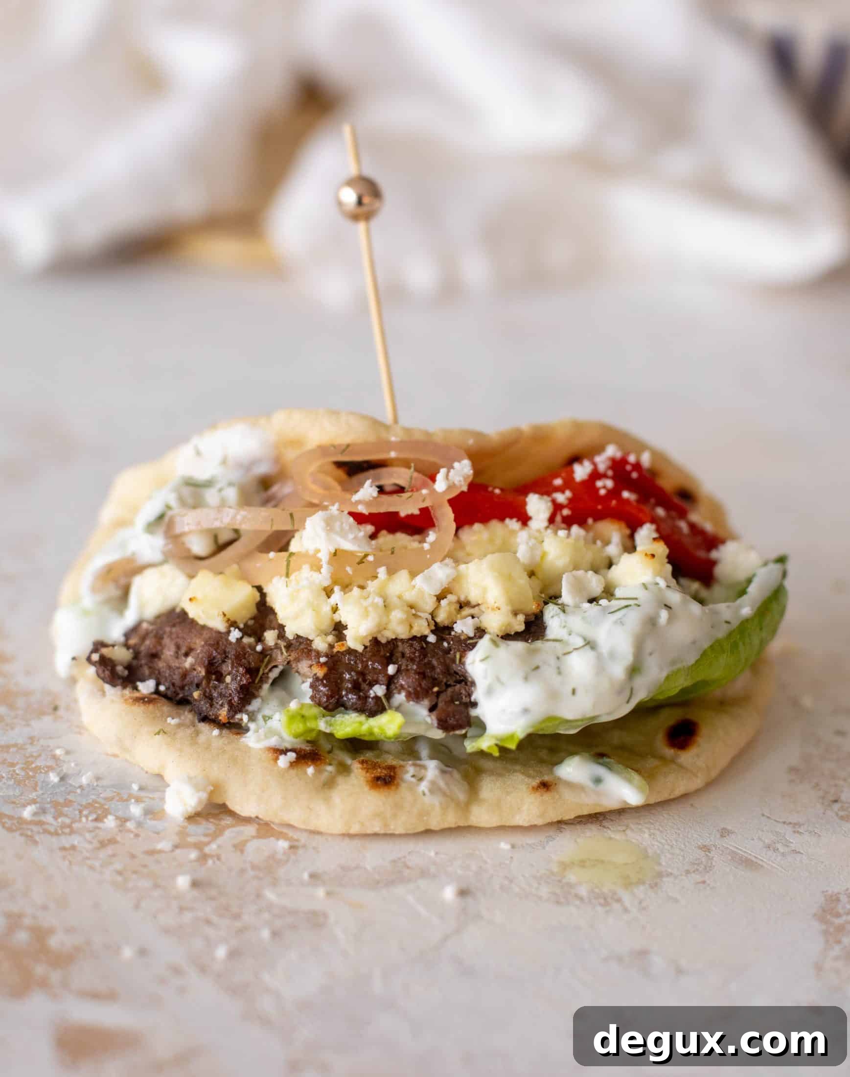 Creamy Feta Burger Pitas with Tangy Mediterranean Sauce 7 greek burgers on pita