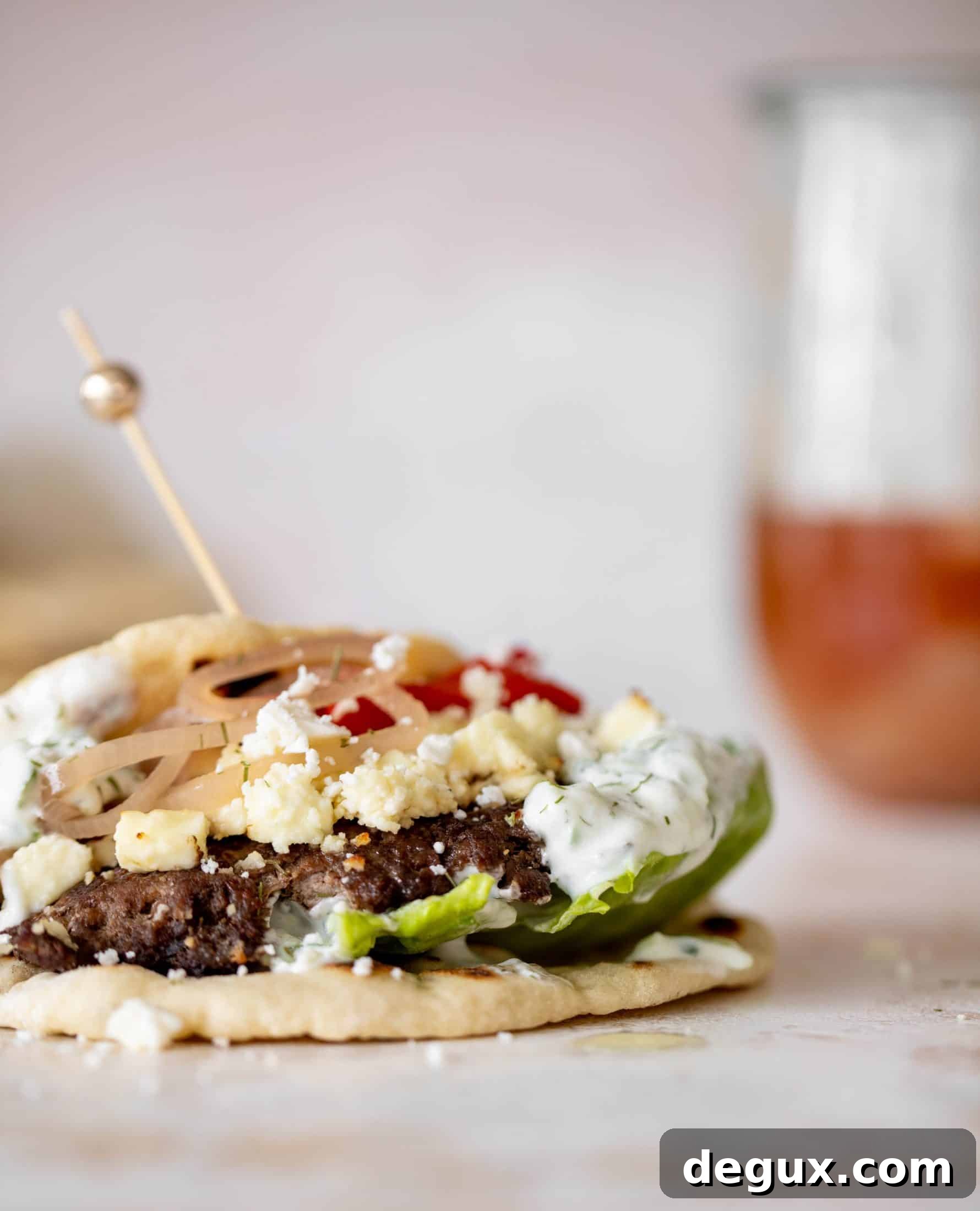 Creamy Feta Burger Pitas with Tangy Mediterranean Sauce 8 greek burgers on pita