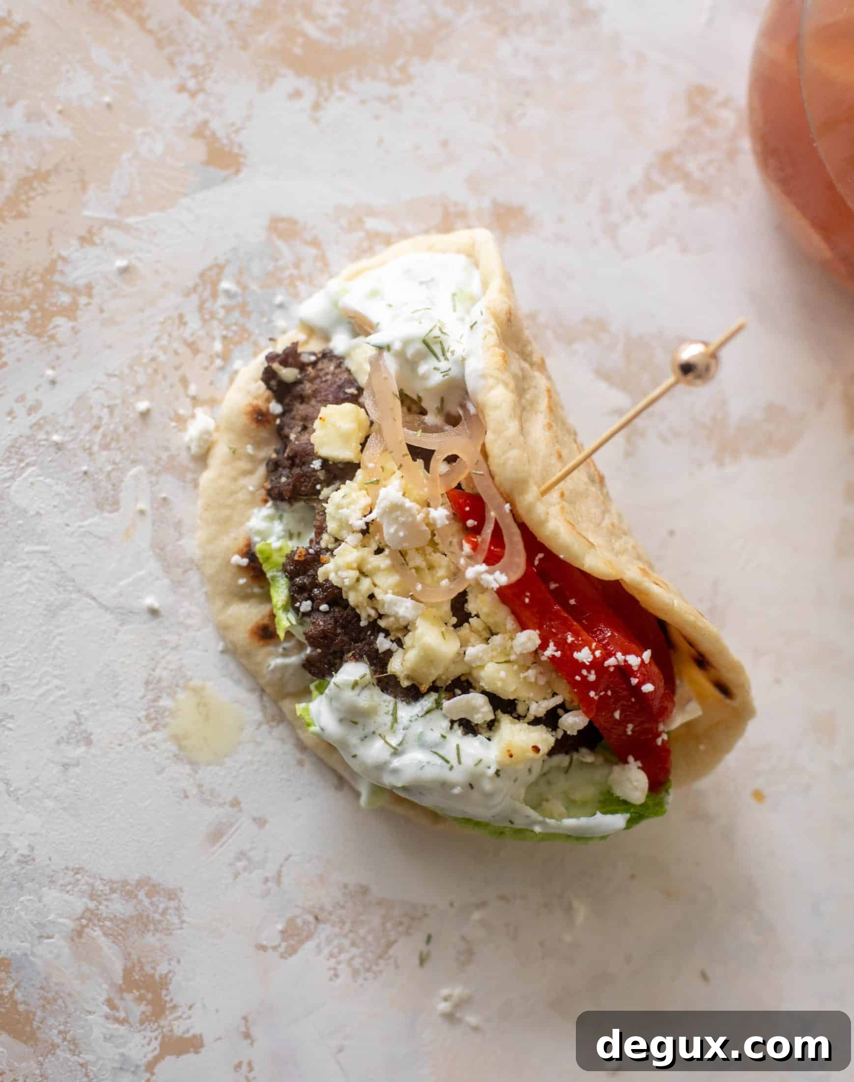Creamy Feta Burger Pitas with Tangy Mediterranean Sauce 9 greek burgers on pita