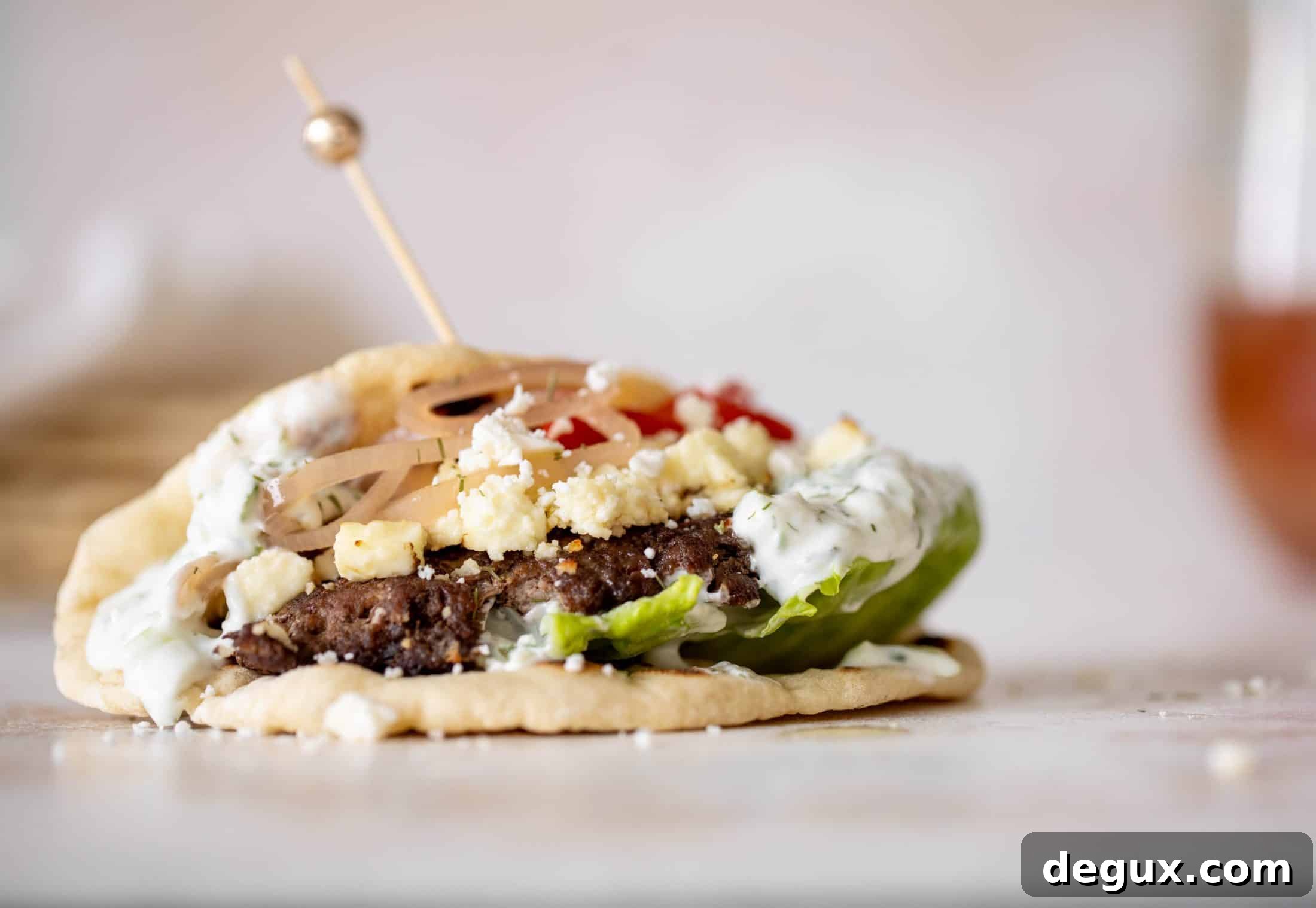 Creamy Feta Burger Pitas with Tangy Mediterranean Sauce 10 greek burgers on pita