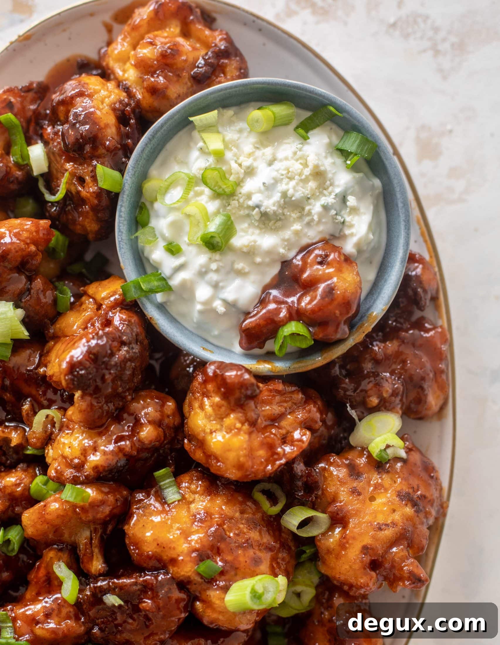 Sticky BBQ Cauliflower Bites with Greek Yogurt Blue Cheese Dip 2 sticky BBQ cauliflower bites