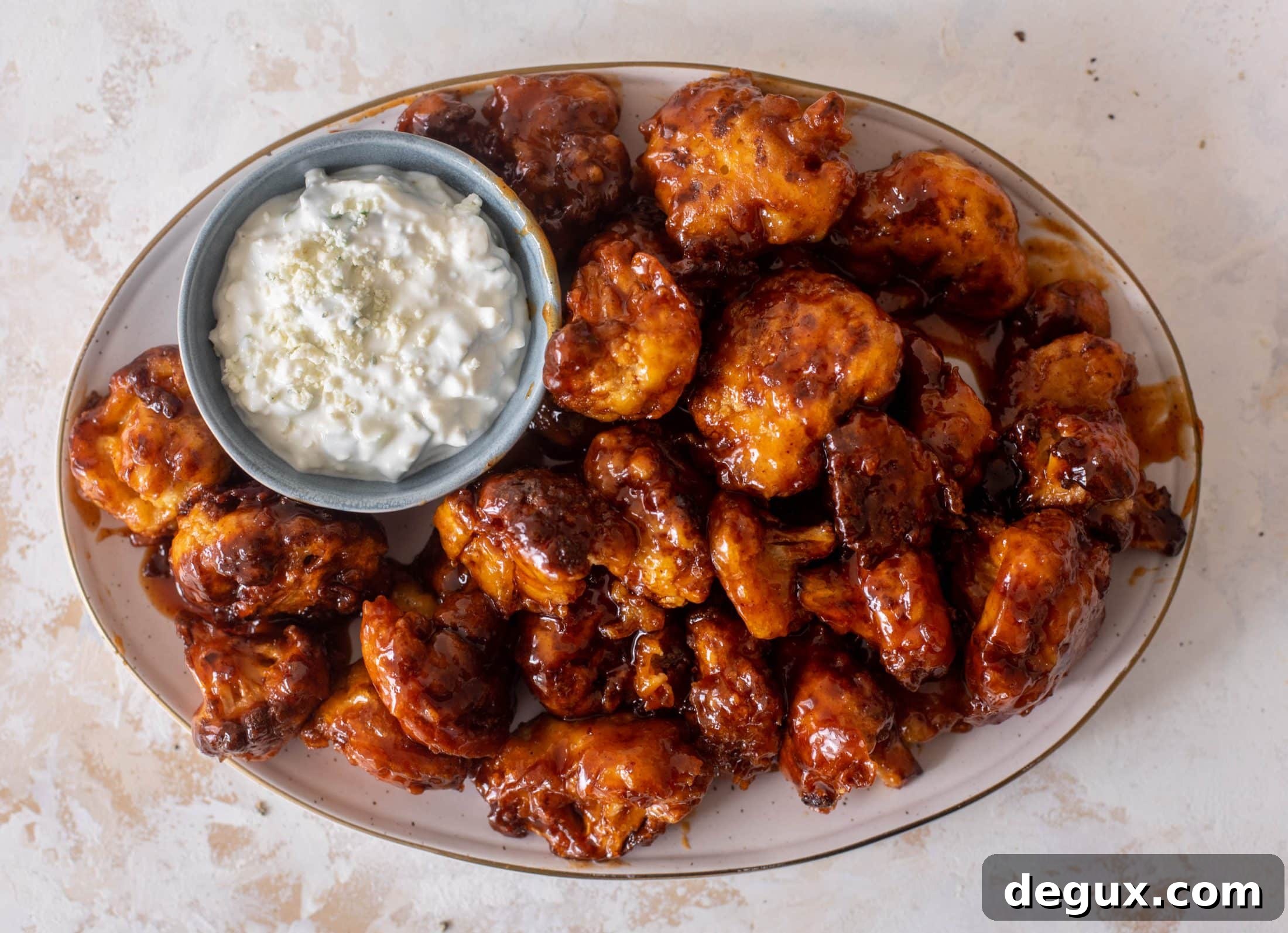 Sticky BBQ Cauliflower Bites with Greek Yogurt Blue Cheese Dip 6 sticky BBQ cauliflower bites