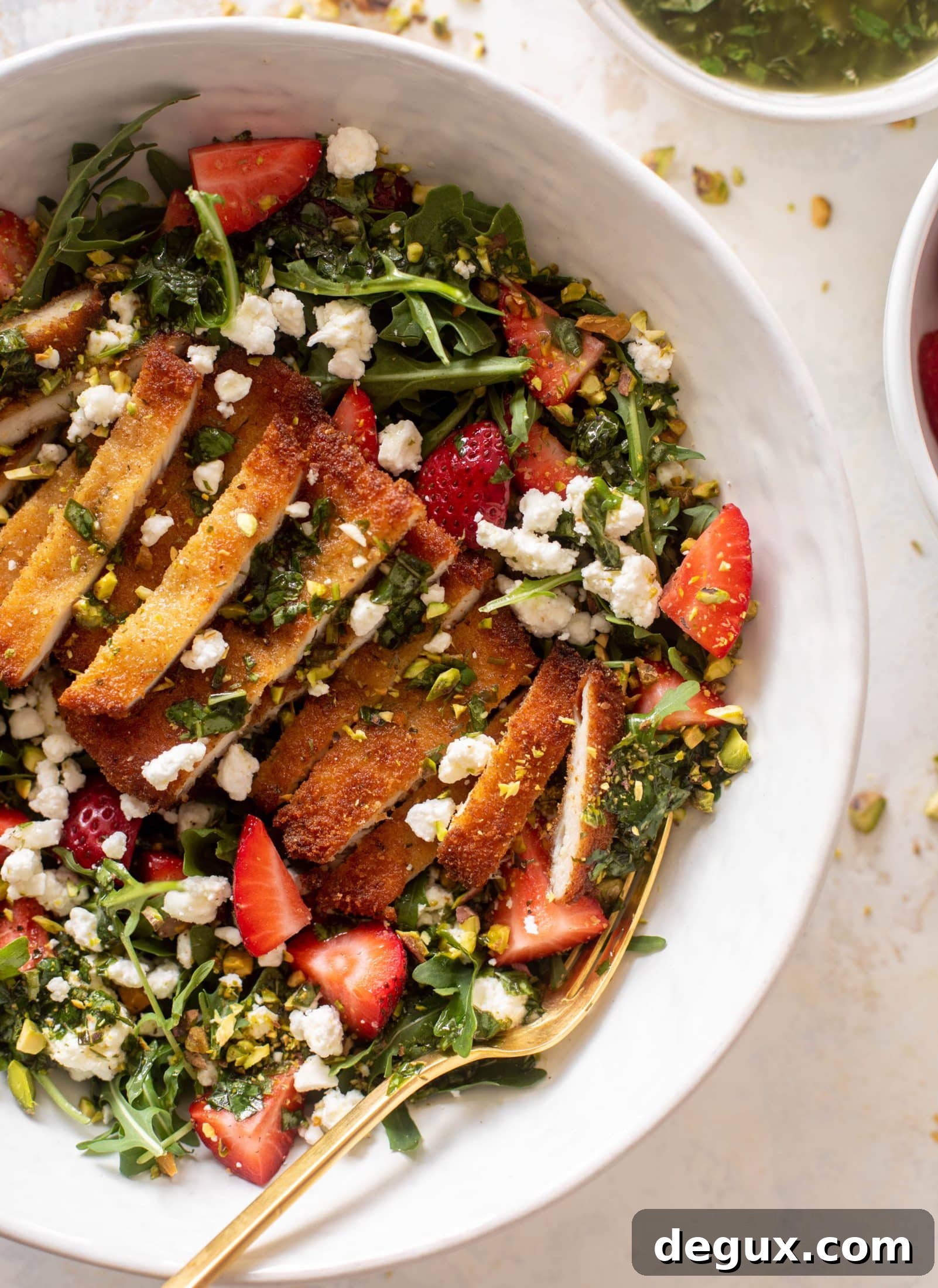 strawberry pistachio salad with crispy chicken