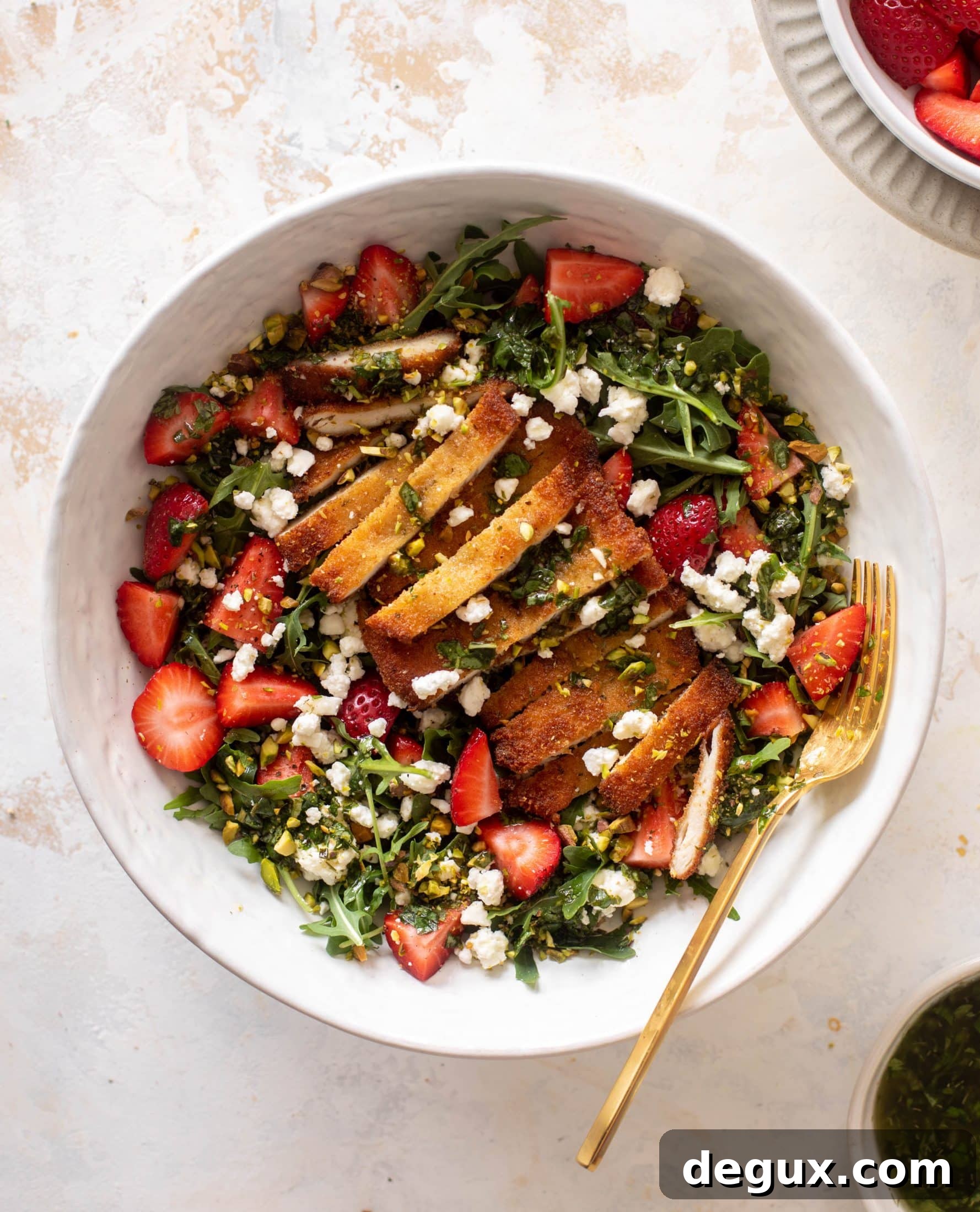 strawberry pistachio salad with crispy chicken