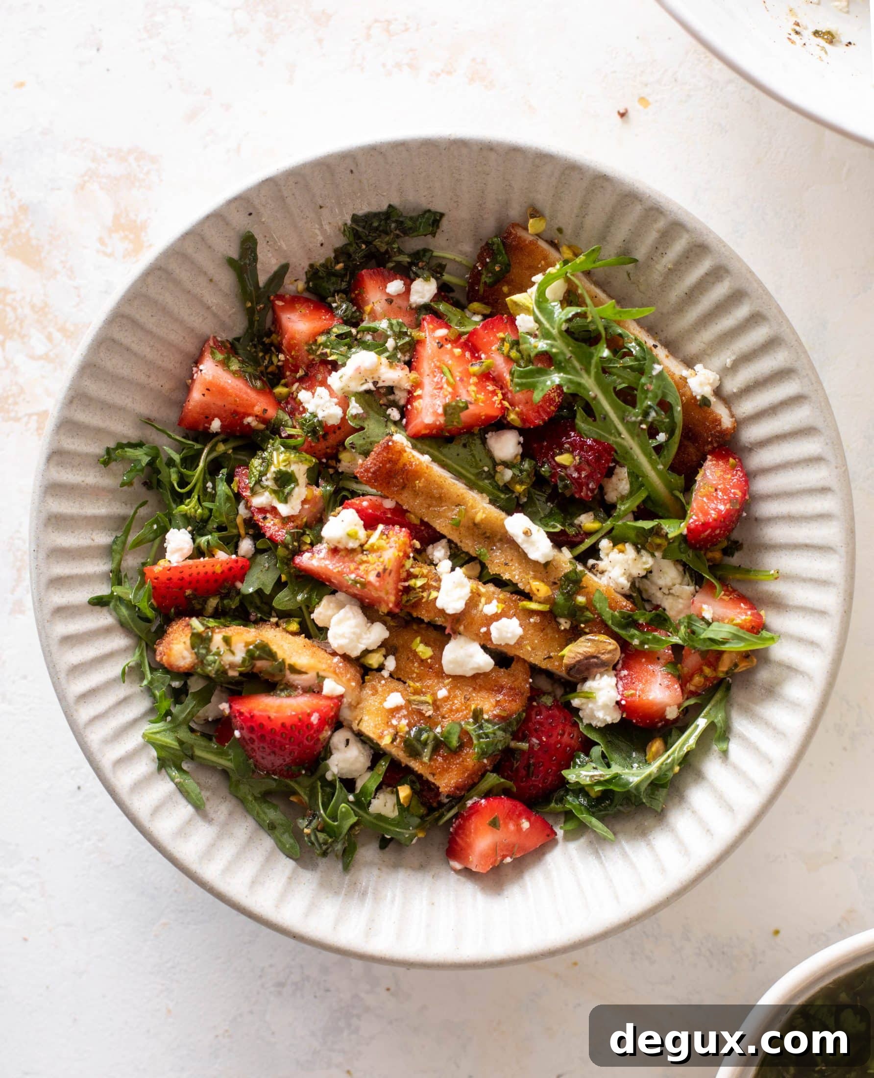 strawberry pistachio salad with crispy chicken