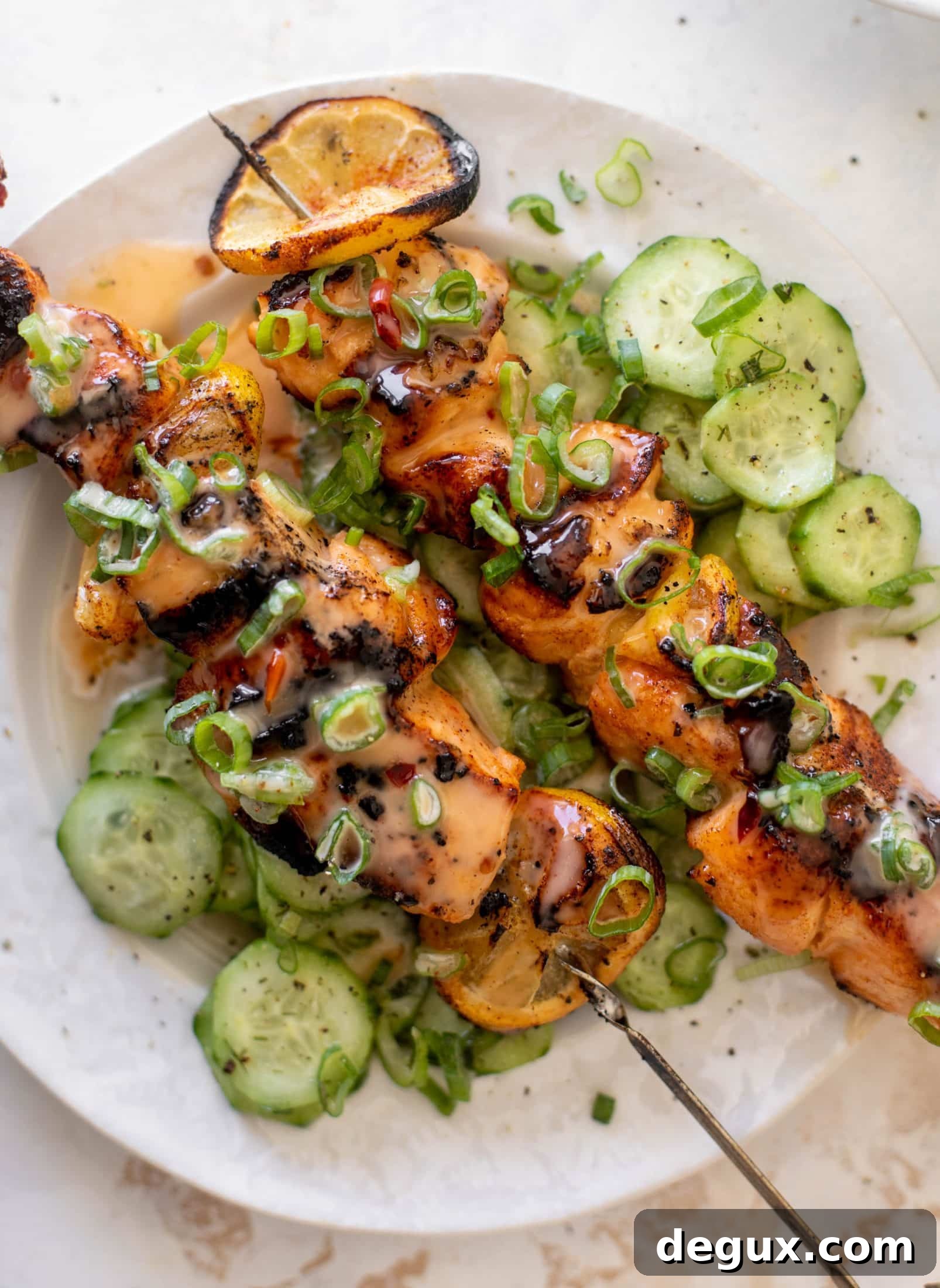 Grilled Bang Bang Salmon Skewers with Crisp Cucumber Salad 13 grilled bang bang salmon with cucumber salad