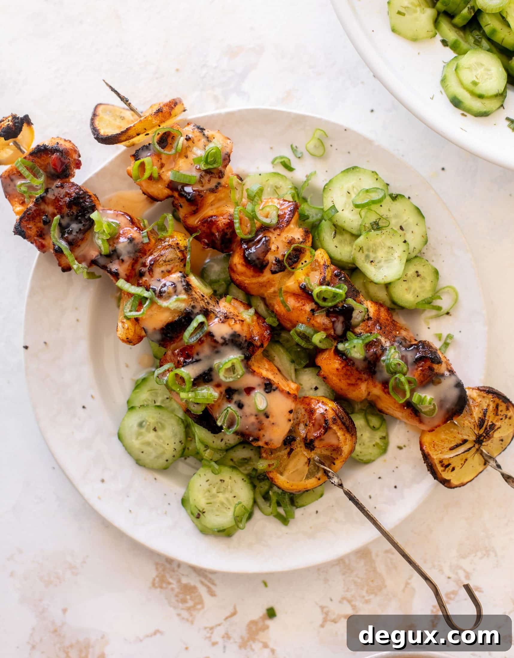 Grilled Bang Bang Salmon Skewers with Crisp Cucumber Salad 10 grilled bang bang salmon with cucumber salad