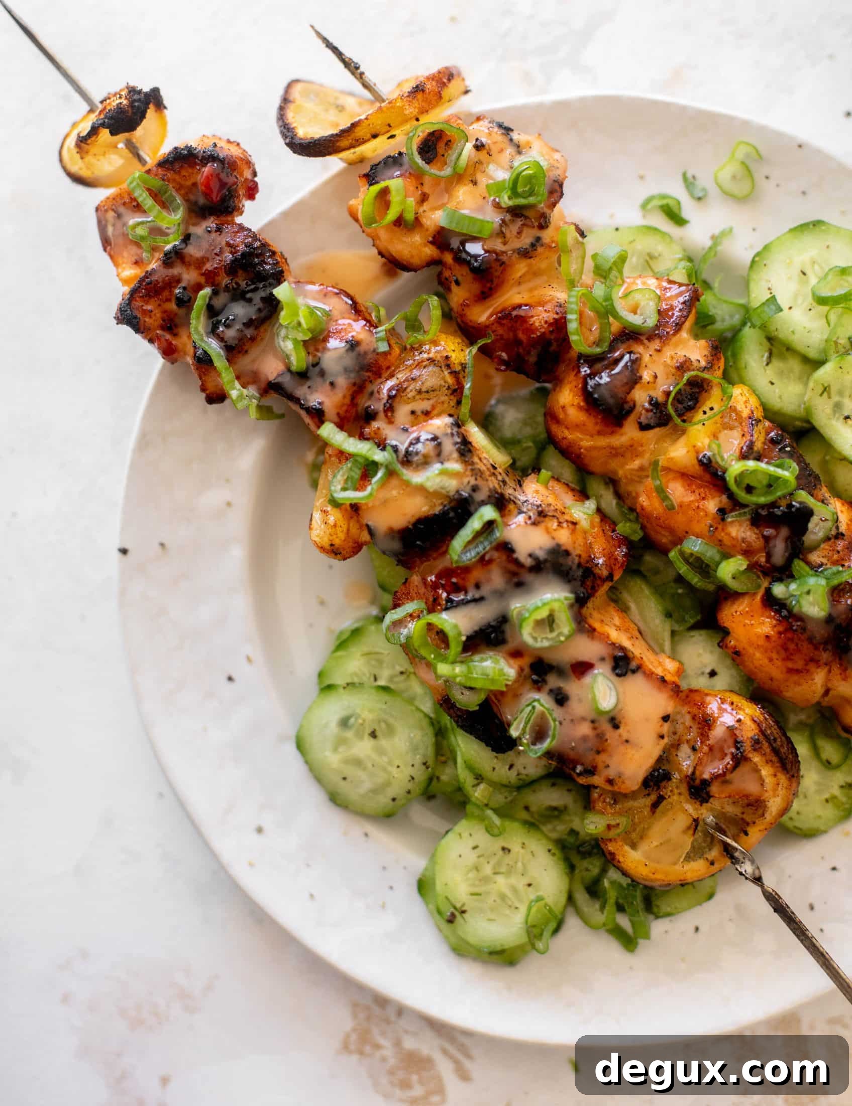 Grilled Bang Bang Salmon Skewers with Crisp Cucumber Salad 11 grilled bang bang salmon with cucumber salad