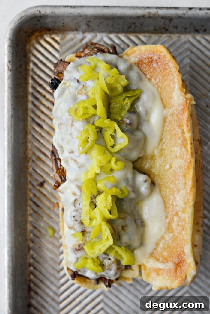 Slow-Cooker Mississippi Pot Roast Sandwich Recipe 11 top with sliced pepperoncini