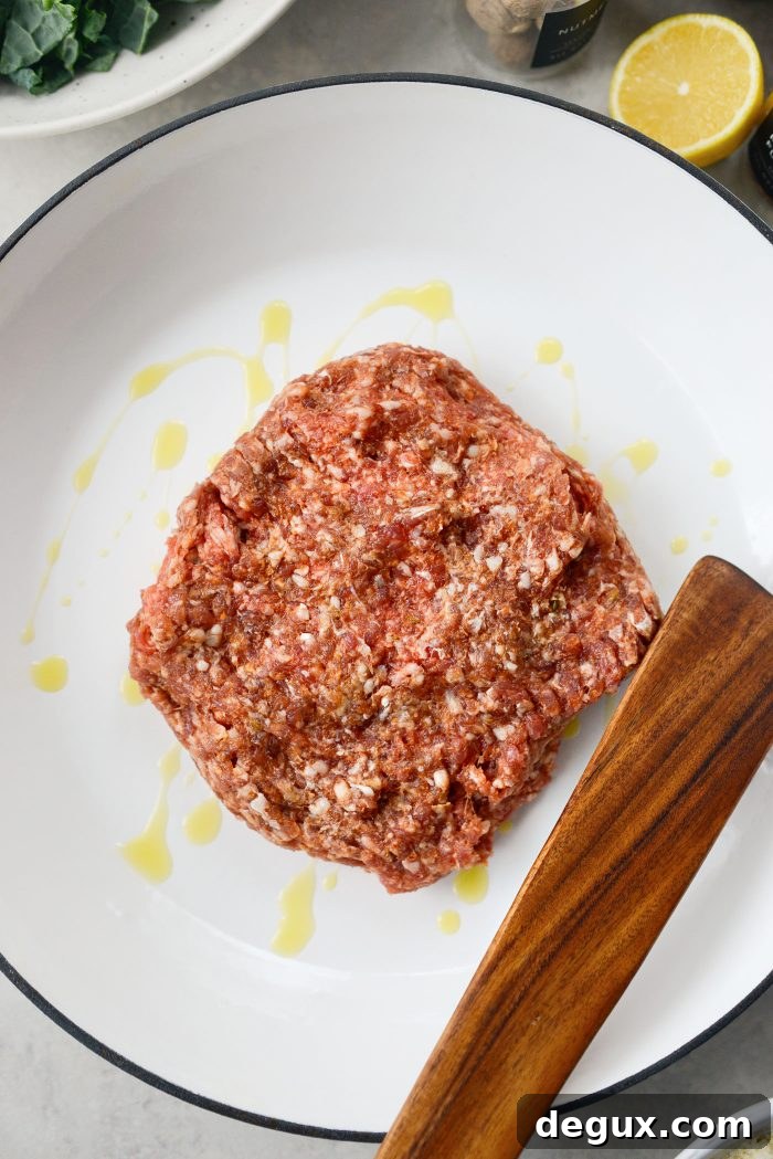 add oil and sausage to pan