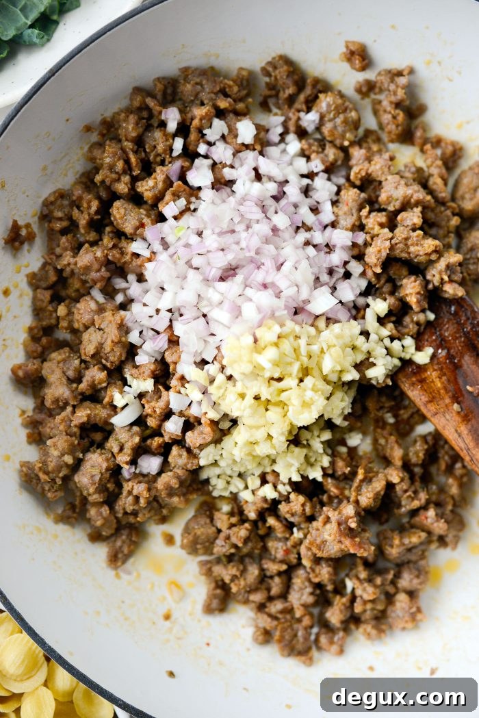 add shallot and garlic to browned sausage
