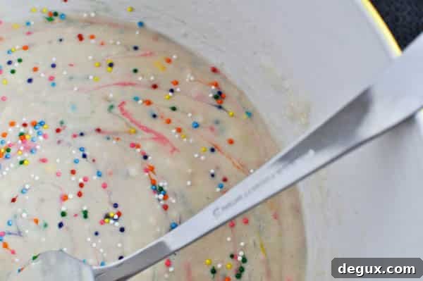 cake batter pancakes I howsweeteats.com #cakebatter #pancakes #breakfast #sprinkles #funfetti