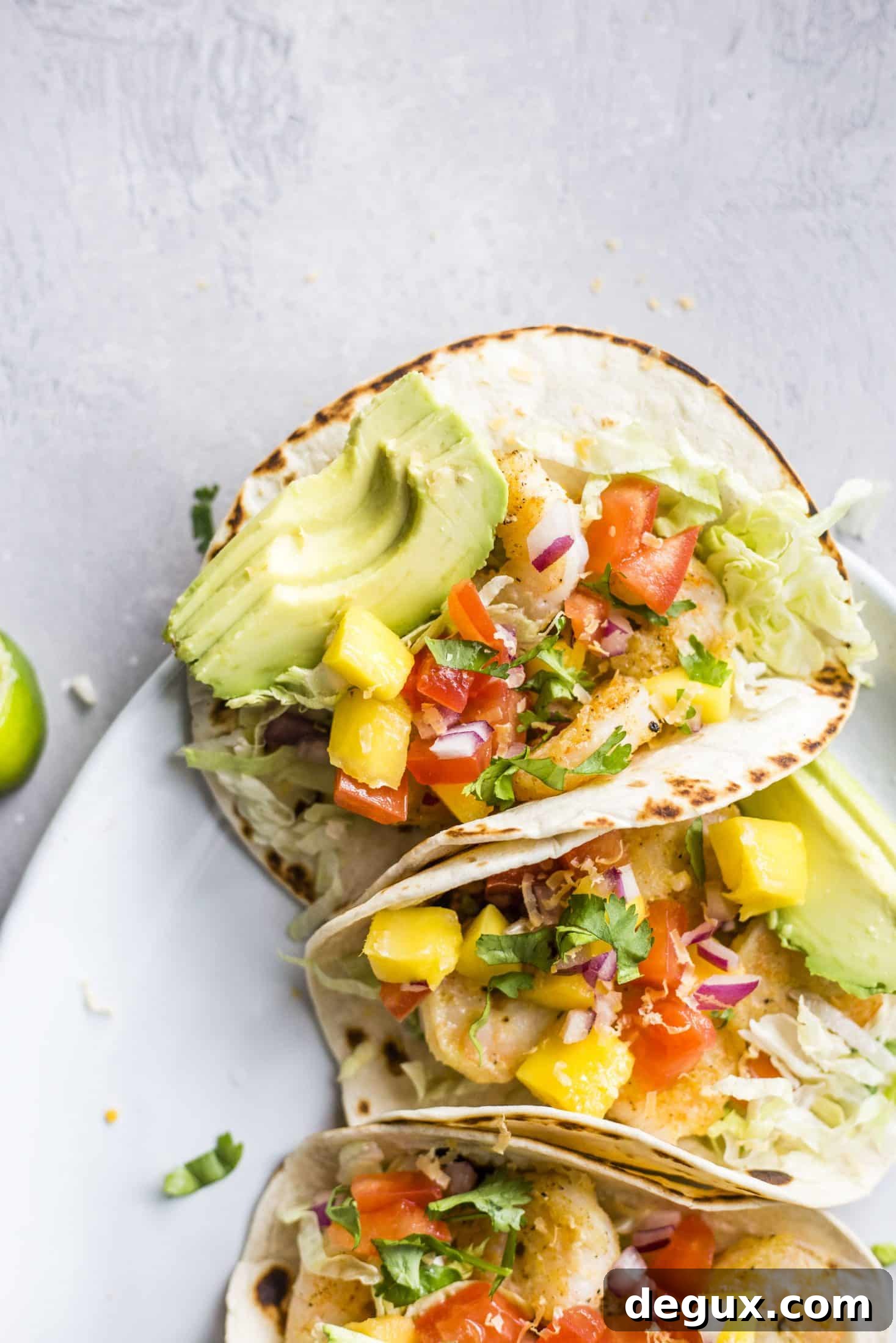 Crispy Shrimp Tacos with Lime Slaw and Spicy Aioli 3 crispy shrimp tacos I howsweeteats.com #shrimp #tacos #seafood #healthy #recipes