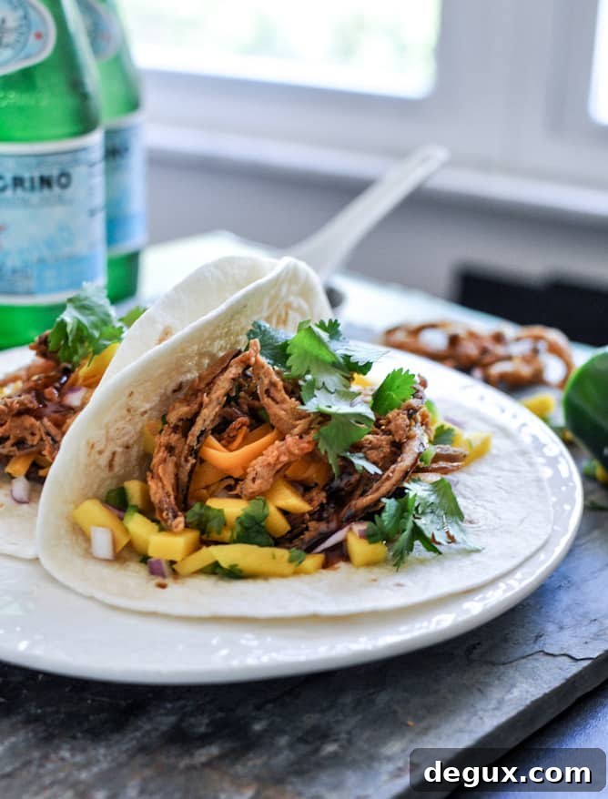 Crockpot BBQ Beer Pulled Pork Tacos with Crispy Onion Straws and Mango Salsa Crockpot BBQ Beer Pulled Pork Tacos with Crispy Onion Straws and Mango Salsa