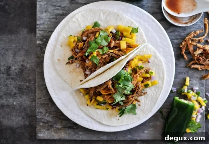 Crockpot BBQ Beer Pulled Pork Tacos with Crispy Onion Straws and Mango Salsa Crockpot BBQ Beer Pulled Pork Tacos with Crispy Onion Straws and Mango Salsa