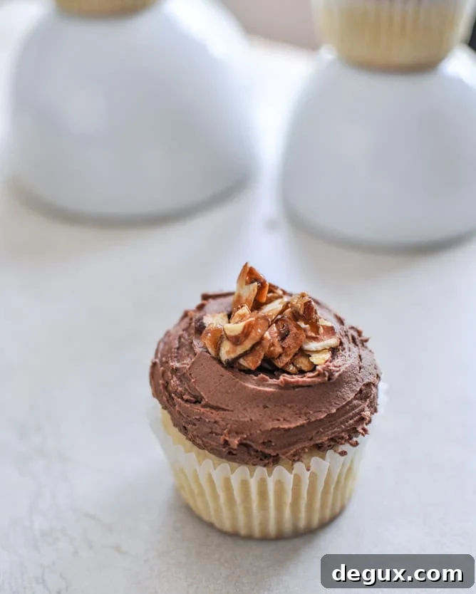 Sugared Toasted Almond Cupcakes with Chocolate Frosting I howsweeteats.com