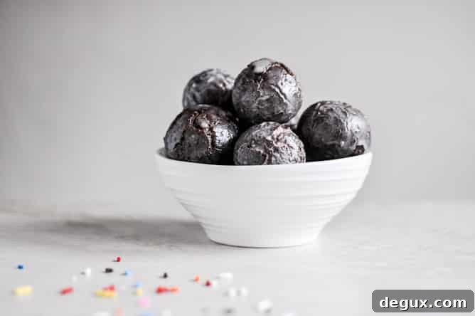 Glazed and Sprinkled Chocolate Cake Donut Holes I howsweeteats.com