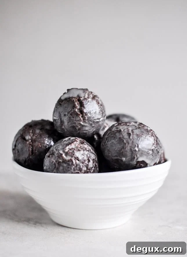 Glazed and Sprinkled Chocolate Cake Donut Holes I howsweeteats.com