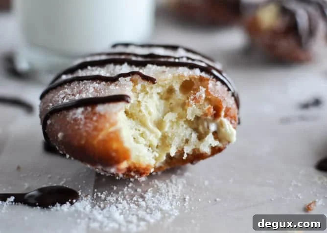 Peanut Butter Cream Filled Donuts I howsweeteats.com