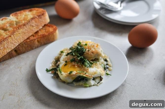 Fontina and Spinach Baked Eggs with Garlic Brown Butter Breadcrumbs I howsweeteats.com Fontina and Spinach Baked Eggs with Garlic Brown Butter Breadcrumbs I howsweeteats.com