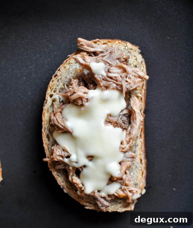 Crockpot Pulled Pork + Beer Cheese Grilled Cheese Sandwiches I howsweeteats.com Crockpot Pulled Pork + Beer Cheese Grilled Cheese Sandwiches I howsweeteats.com