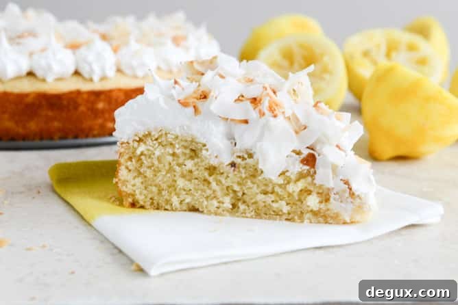 Easy Lemon Cake with Marshmallow Frosting + Toasted Coconut I howsweeteats.com