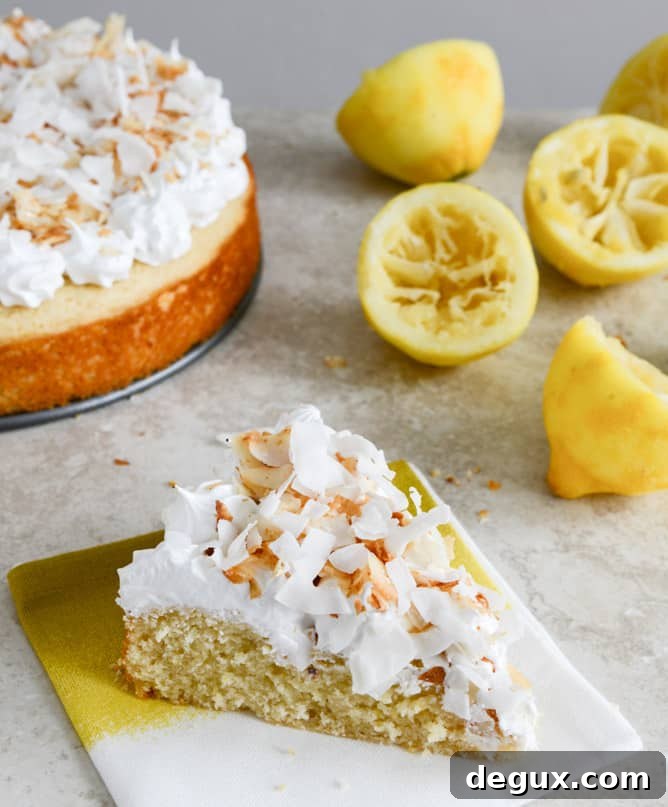 Easy Lemon Cake with Marshmallow Frosting + Toasted Coconut I howsweeteats.com