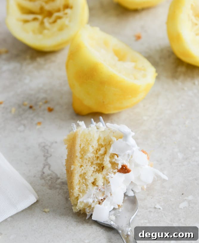 Easy Lemon Cake with Marshmallow Frosting + Toasted Coconut I howsweeteats.com