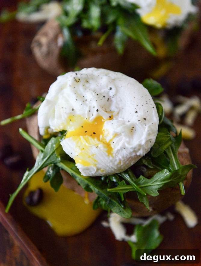 Cheesy Black Bean Stuffed Sweet Potatoes with Arugula + Poached Eggs I howsweeteats.com