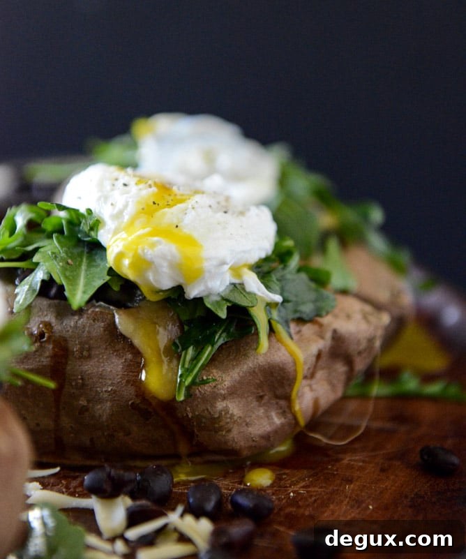 Cheesy Black Bean Stuffed Sweet Potatoes with Arugula + Poached Eggs I howsweeteats.com