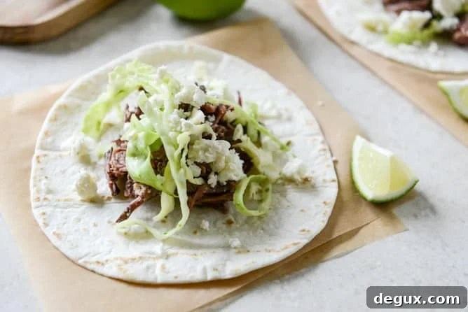Crockpot Short Rib Tacos with Salted Lime Cabbage and Queso Fresco I howsweeteats.com Crockpot Short Rib Tacos with Salted Lime Cabbage and Queso Fresco I howsweeteats.com