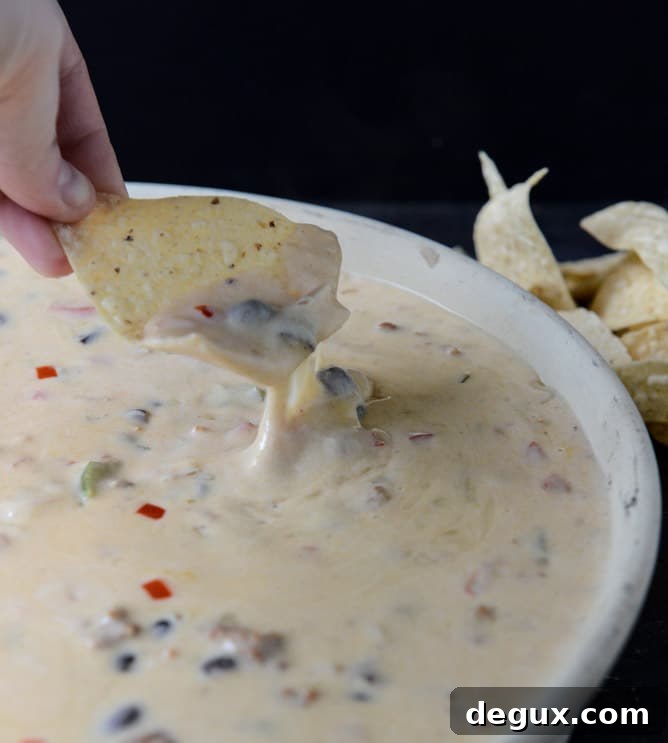 Spicy Beer Queso with Chorizo and Black Beans I howsweeteats.com