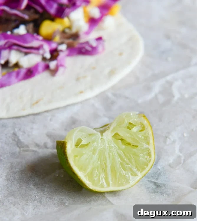 Crockpot Smoky Brisket Tacos with Shredded Cabbage + Sweet Corn I howsweeteats.com