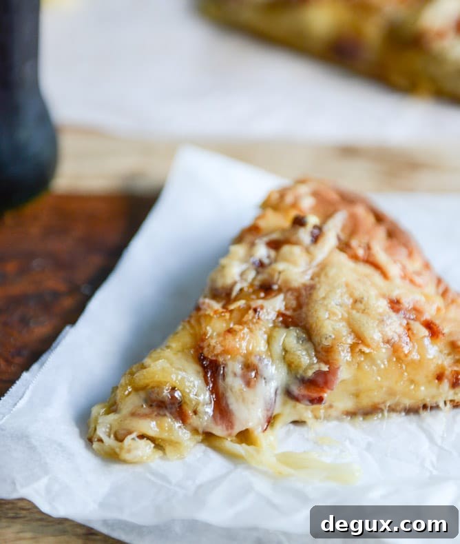 Whole wheat pizza fresh from the oven with caramelized onions and gruyere