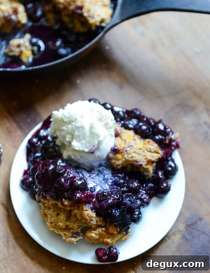 Skillet Blueberry Cobbler with a Cheddar Biscuit Crust