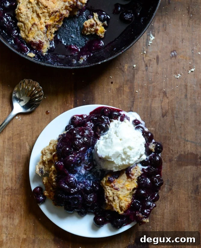 Skillet Blueberry Cobbler with a Cheddar Biscuit Crust