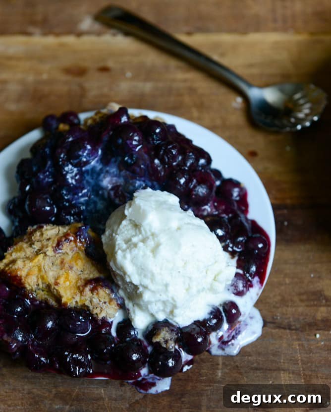 Skillet Blueberry Cobbler with a Cheddar Biscuit Crust