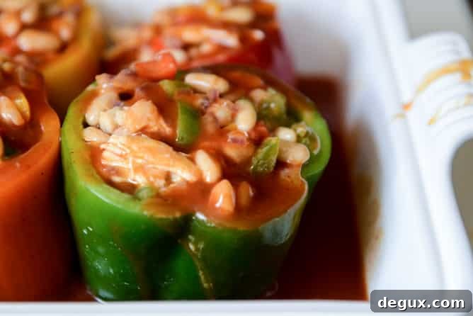 White Bean + Chicken Enchilada Stuffed Peppers I howsweeteats.com