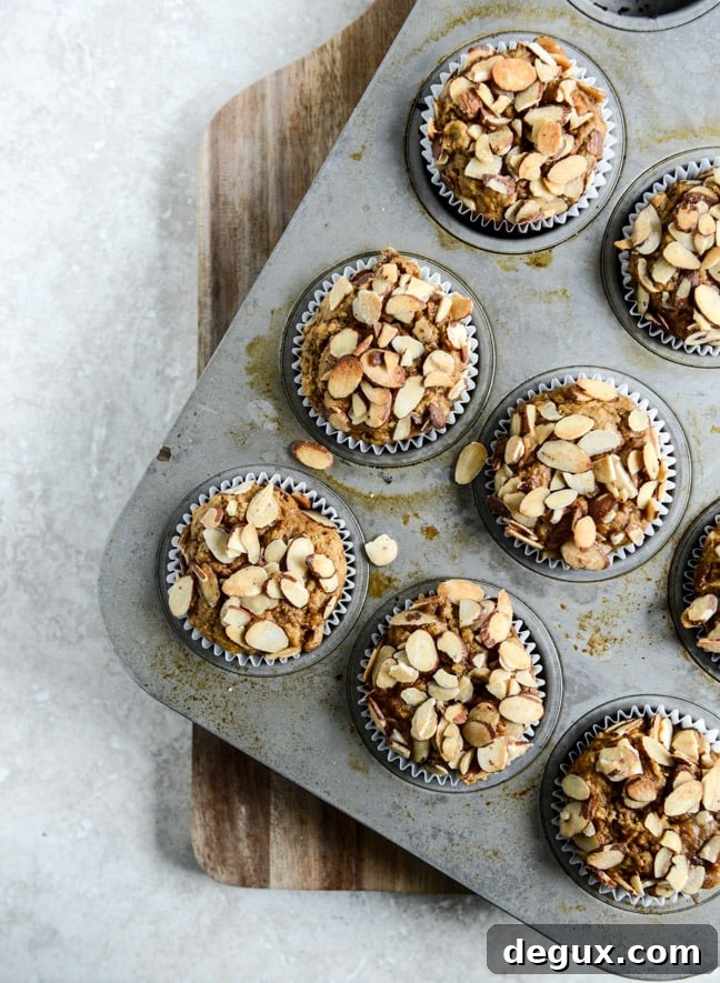 Whole Wheat Pumpkin Almond Muffins I howsweeteats.com
