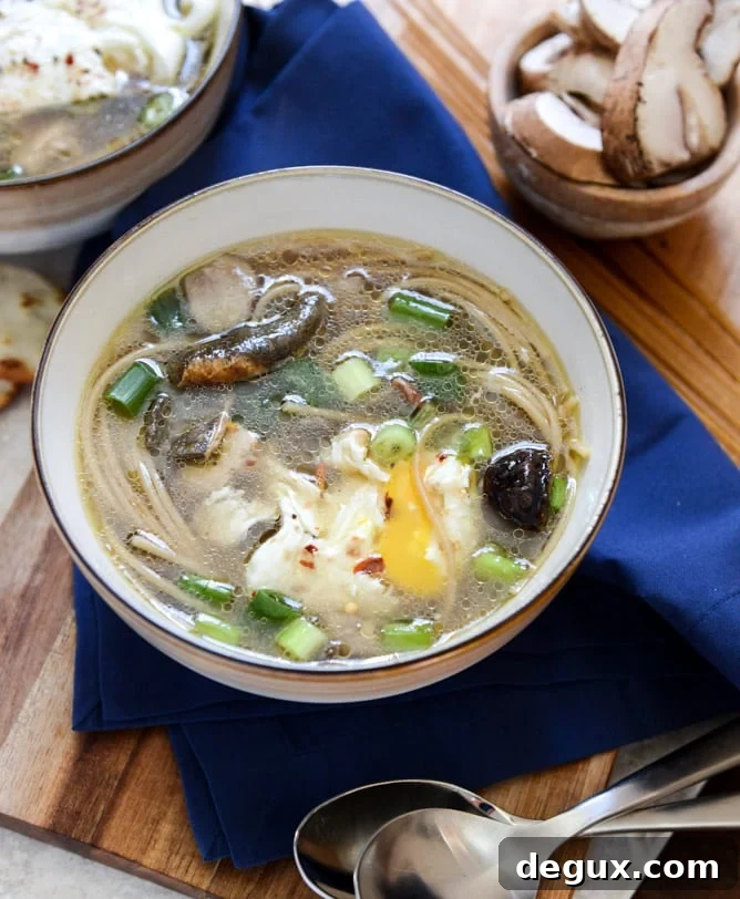 Chicken + Mushroom Noodle Soup with Poached Eggs I howsweeteats.com Chicken + Mushroom Noodle Soup with Poached Eggs I howsweeteats.com