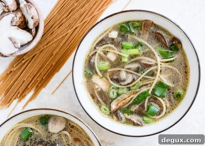 Chicken + Mushroom Noodle Soup with Poached Eggs I howsweeteats.com Chicken + Mushroom Noodle Soup with Poached Eggs I howsweeteats.com